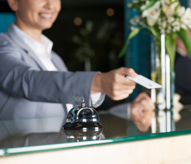 Woman Holding Plastic Hotel Key Card